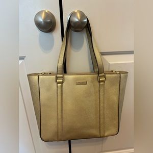 Gold Kate Spade satchel! Great condition, some stains on inside as shown.